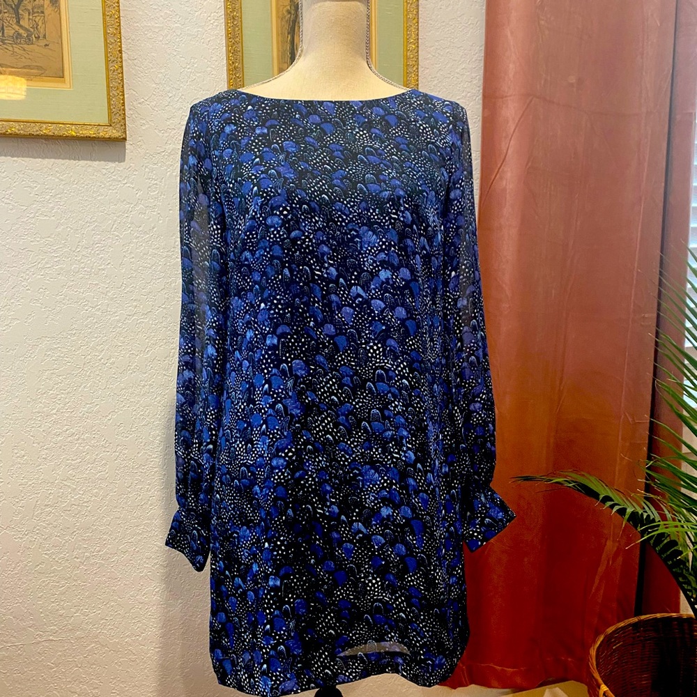 Beautiful & flattering.Sheer light fabric tailored to solid. Sheer sleeves.
